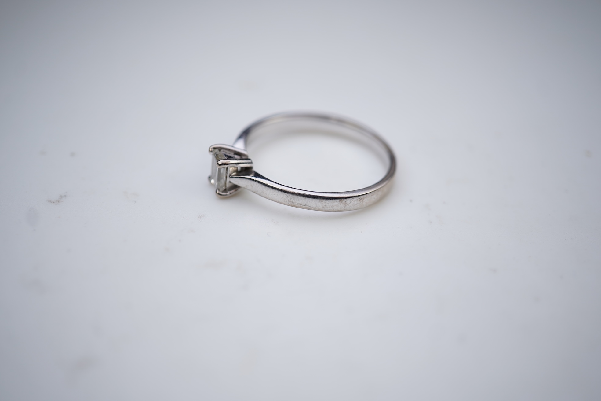 A diamond solitaire ring
